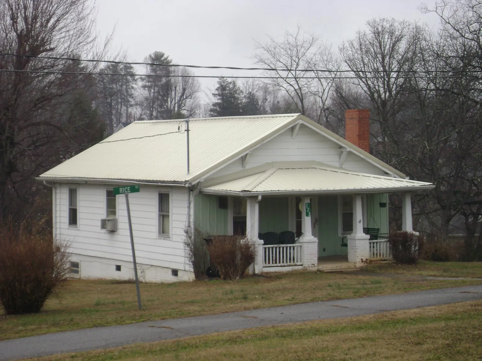 White metal roof on a craftsman bungalow at a street corner in Kearneysville